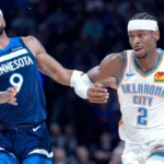 Shai Gilgeous-Alexander drives past Anthony Edwards during the 2025 NBA Western Conference Finals Game.