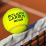 Players compete at Roland-Garros during the 2025 French Open with full stadium crowd