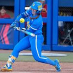 UCLA softball player Megan Grant rounding bases after home run vs Tennessee in 2025 WCWS, highlighting NCAA Appendix G rule