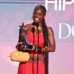 A wide shot of the brightly lit stage at the Peacock Theater during the BET Awards 2025 ceremony