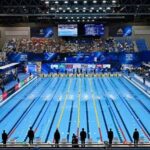 Swimmers dive into pool at the World Aquatics Championships 2025 in Singapore