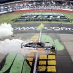Cars racing at Iowa Speedway during the 2025 NASCAR Iowa Corn 350 event